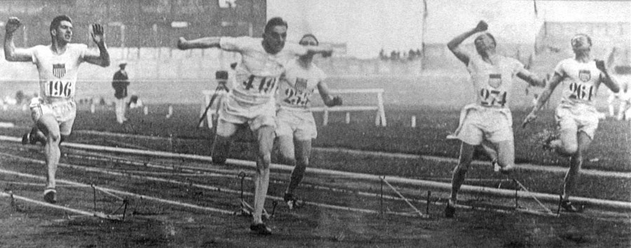 Harold Abrahams dips in time to take gold in the 100m