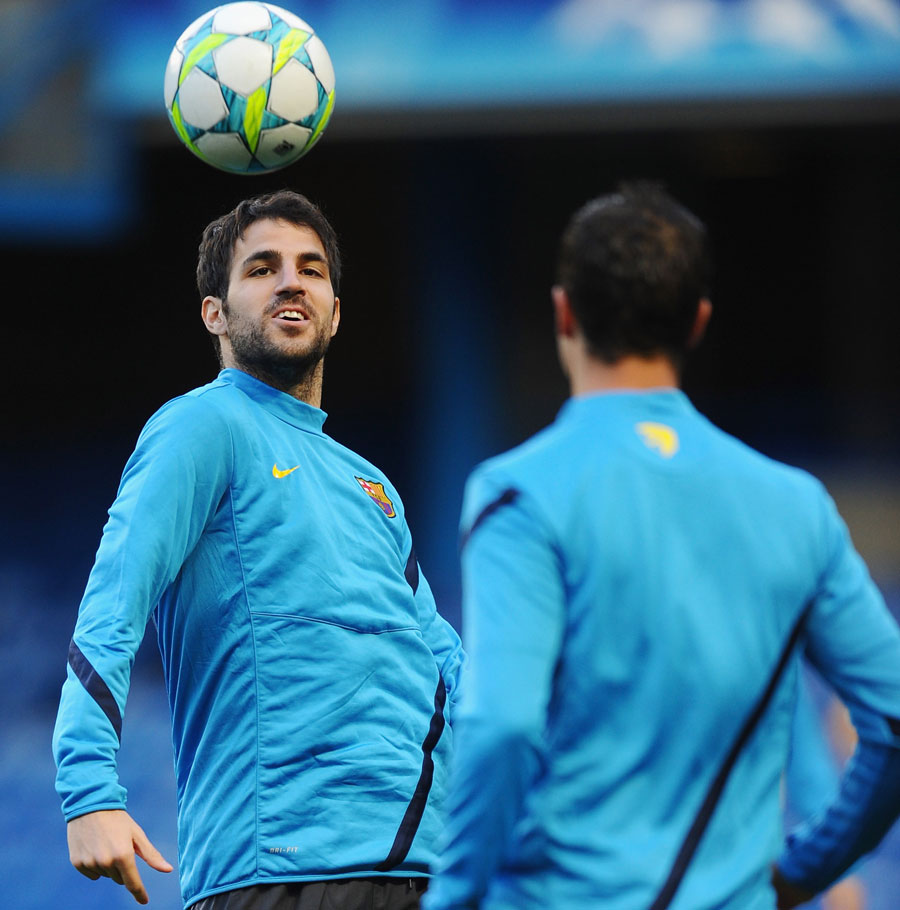 Cesc Fabregas controls the ball