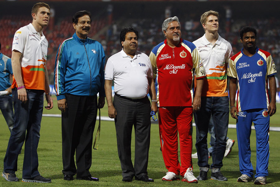 Formula 1 drivers Paul di Resta and Nico Hulkenberg with other big names at the Chinnaswamy Stadium