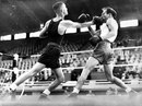 Oivind Breiby showed his durability by taking this punch from Gerald Dreyer and still winning gold in the lightweight event