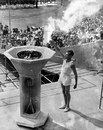 Britain's John Mark lit the Olympic Flame to open the Games