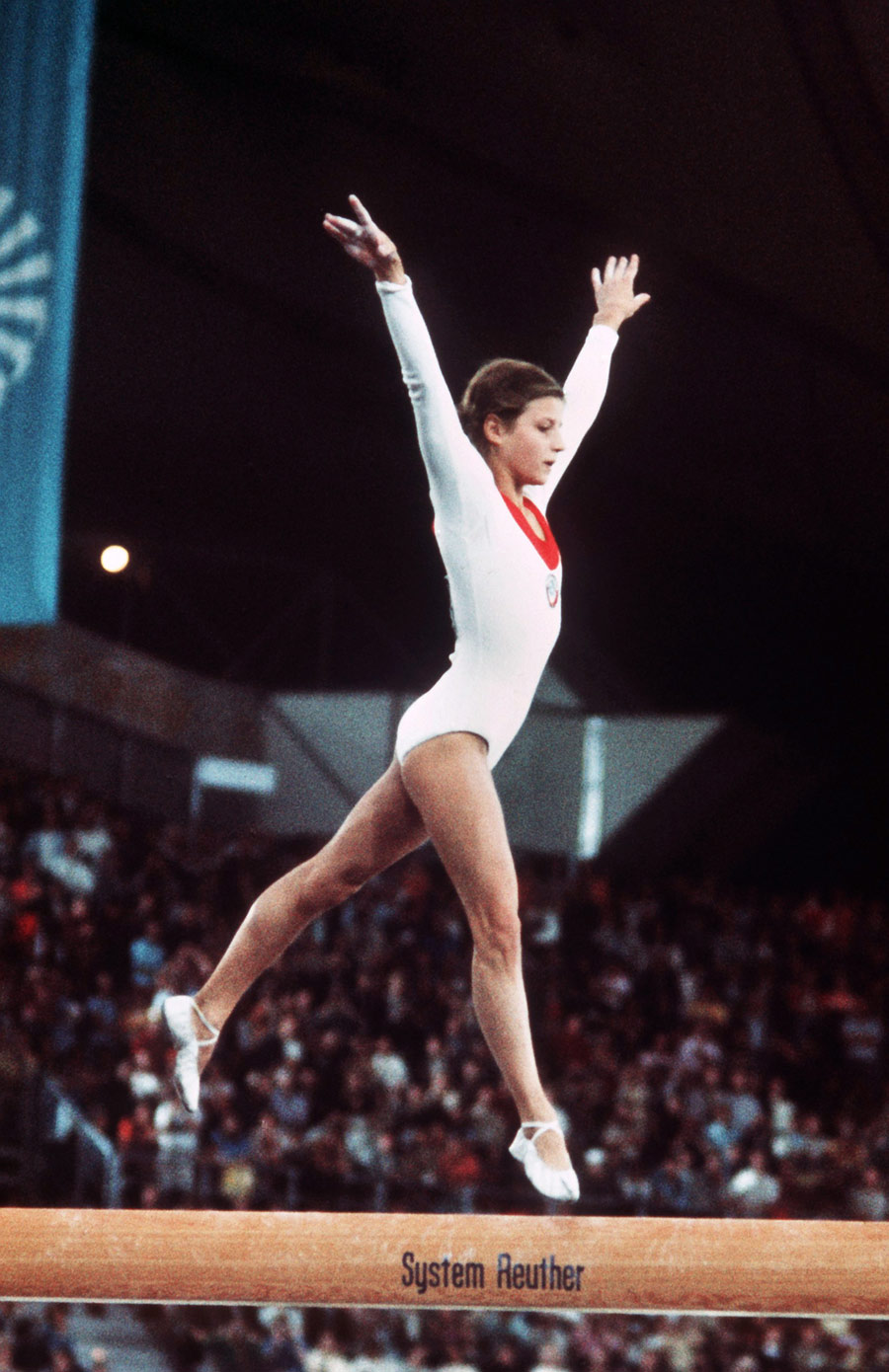 Olga Korbut won gold in the team competition, beam and the floor