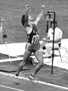 Bruce Jenner celebrates winning gold in the decathlon with a new world record points total of 8618