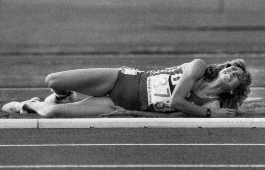 Mary Decker-Slaney was left in pain on the side of the track after a collision with Zola Budd during the women's 3000m final 