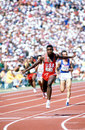 Carl Lewis won his fourth gold of the Games when bringing hom the US 4x100m team in a new world record time of 37.83 secs
