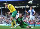 Grant Holt fights for the ball