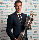 Robin van Persie poses with the trophy