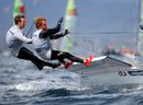 Dave Evans and Ed Powys from Skandia Team GBR round the windward mark