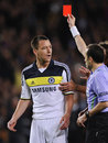 John Terry struggles to hide his disbelief after he is shown a red card