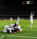 Chelsea players mob Fernando Torres after his late goal