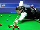 Mark Selby looks to pot a red