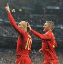 Arjen Robben celebrates with team-mate Bastian Schweinsteiger