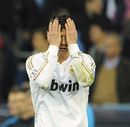 Cristiano Ronaldo holds his head in his hands