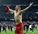 Bastian Schweinsteiger celebrates after scoring the winning penalty