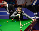 Ali Carter looks to pot a red