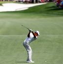 Tiger Woods goes for the green at Quail Hollow