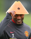 Patrice Evra tips his unusual hat