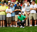 Tiger Woods lines up his shot
