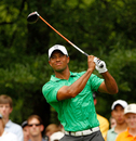 Tiger Woods winces at a drive