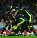 Antolin Alcaraz gets mobbed by his team-mates after scoring the winner