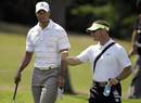 Tiger Woods gets some advice from swing coach Sean Foley