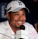 Tiger Woods smiles at a press conference