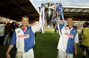 Alan Shearer and Chris Sutton parade the Premier League trophy