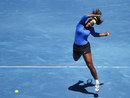 Serena Williams drives through a forehand