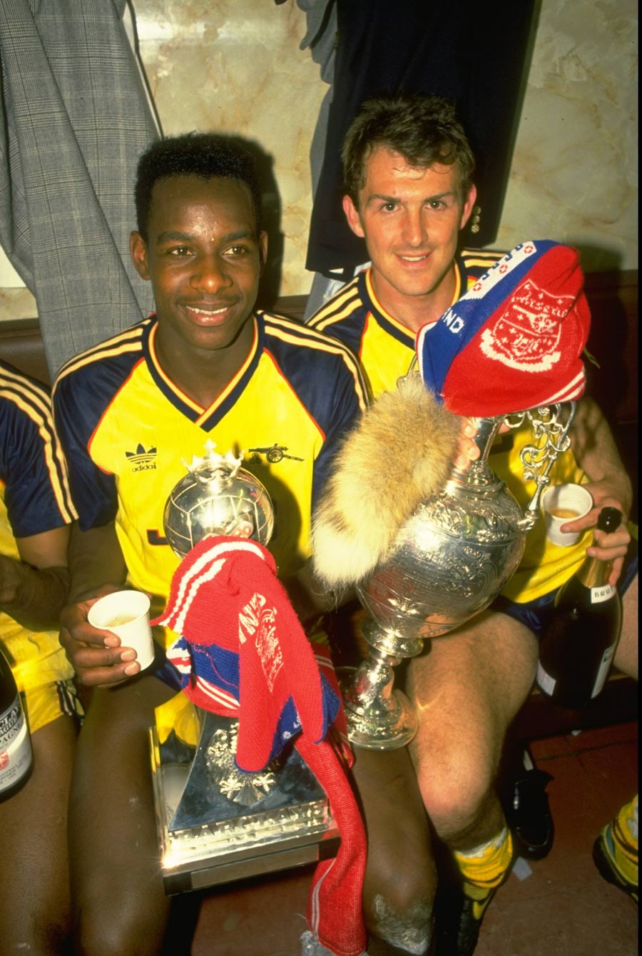 Michael Thomas and Martin Hayes celebrate Arsenal's title success