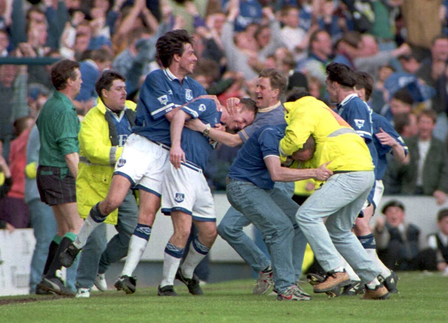 Graham Stuart gets mobbed by his team-mates after scoring the winner for Everton