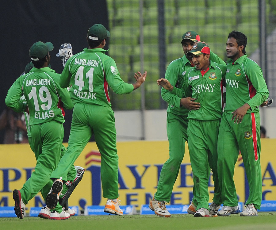 Nasir Hossain is surrounded by team-mates after an impressive catch 