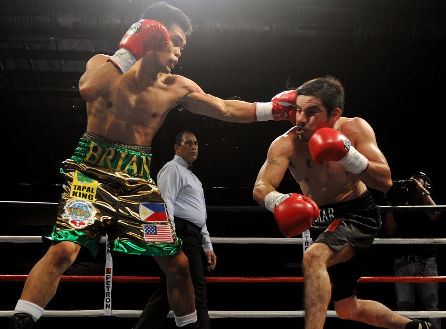 Omar Nino Romero exchanges punches with Brian Viloria