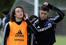 David Luiz and Gary Cahill leave the pitch after a training session
