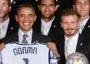 Barack Obama grins alongside David Beckham