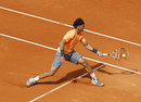 Rafael Nadal slides in for a forehand