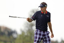 Ian Poulter signals with his putter