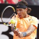 Rafael Nadal returns the ball to David Ferrer 
