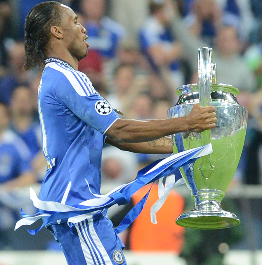 Didier Drogba runs away with the Champions League trophy