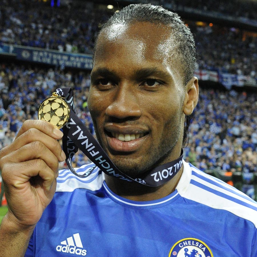 Didier Drogba shows off his winner's medal