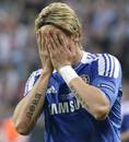 Fernando Torres clasps his head in his hands