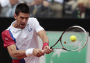 Novak Djokovic hammers a backhand