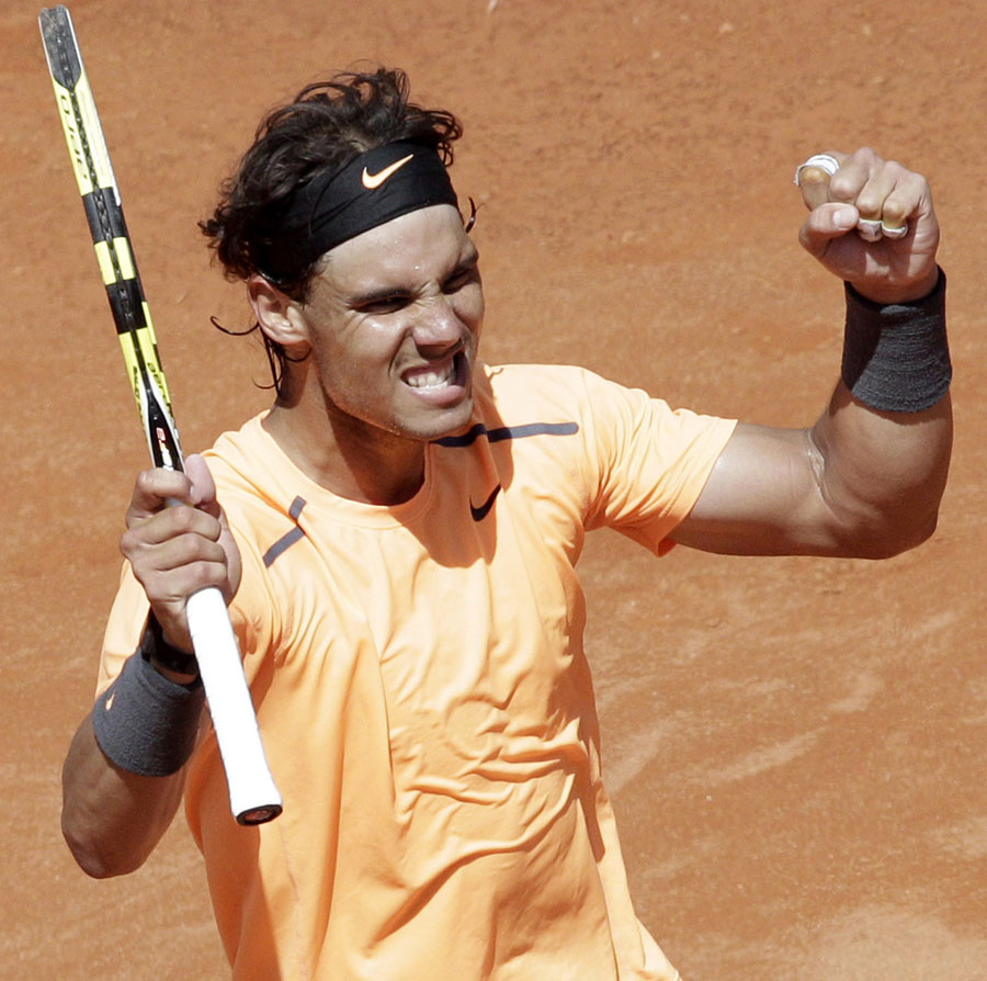 Rafael Nadal celebrates his win over Novak Djokovic
