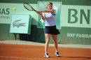 Kim Clijsters returns the ball