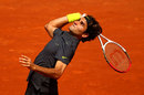 Roger Federer lines up a serve