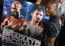 Timothy Bradley poses with a fight poster