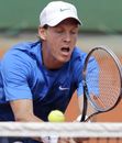 Tomas Berdych stretches for a backhand against Michael Llodra 