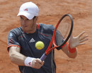 Andy Murray plays a backhand volley