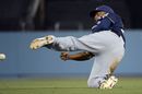 Milwaukee Brewers' second baseman Rickie Weeks tries to throw out Los Angeles Dodgers' Dee Gordon 