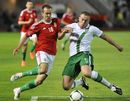 Hungary's Peter Szakaly and Ireland's Richard Dunne challenge for the ball