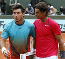 Rafael Nadal is congratulated by Juan Monaco